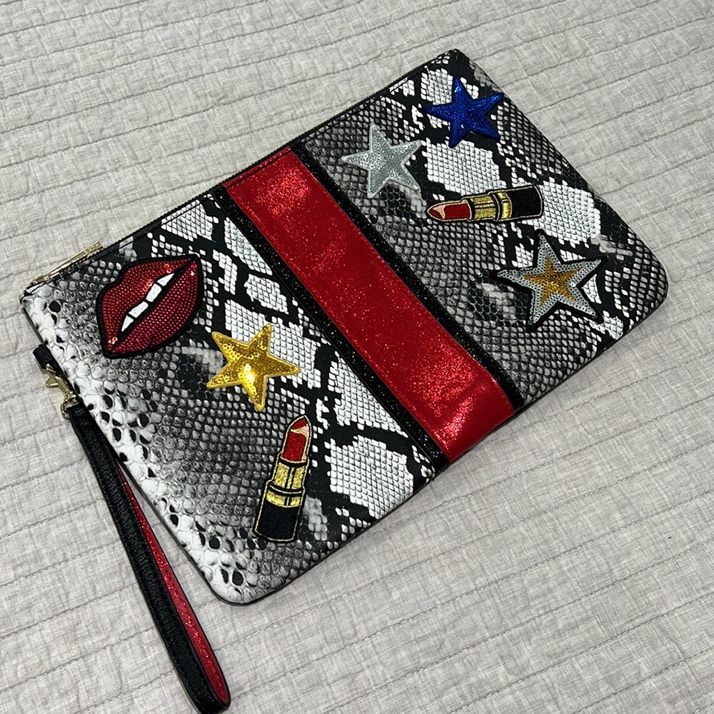 ALDO clutch used once. Absolutely no signs of wear in pristine condition.